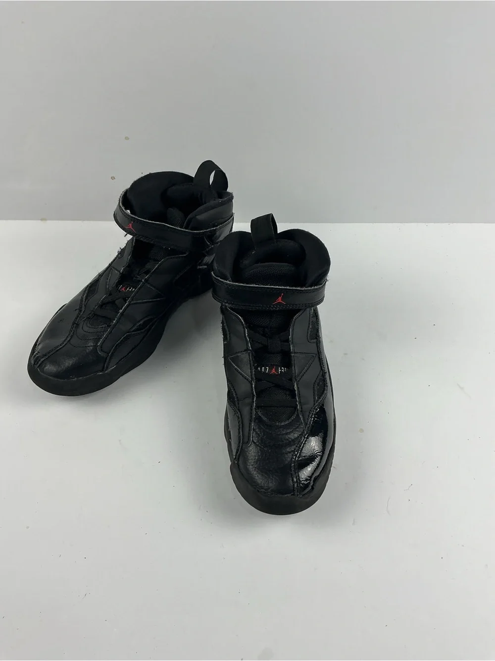 Jordan Black Kids' High-Top Sneakers with Red Jumpman Accents they need inserts